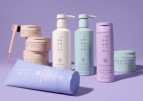 Product shot of entire Fenty Hair line on a purple background. Product shot of entire Fenty Hair line on a purple background.