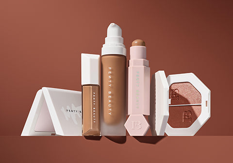 Open product shot of Fenty Beauty Invisimatte, We're Even Concealer, Pro Filter Foundation, Match Sticks Contour, and Killawatt Freestyle Highlighter Duo. Open product shot of Fenty Beauty Invisimatte, We're Even Concealer, Pro Filter Foundation, Match Sticks Contour, and Killawatt Freestyle Highlighter Duo.